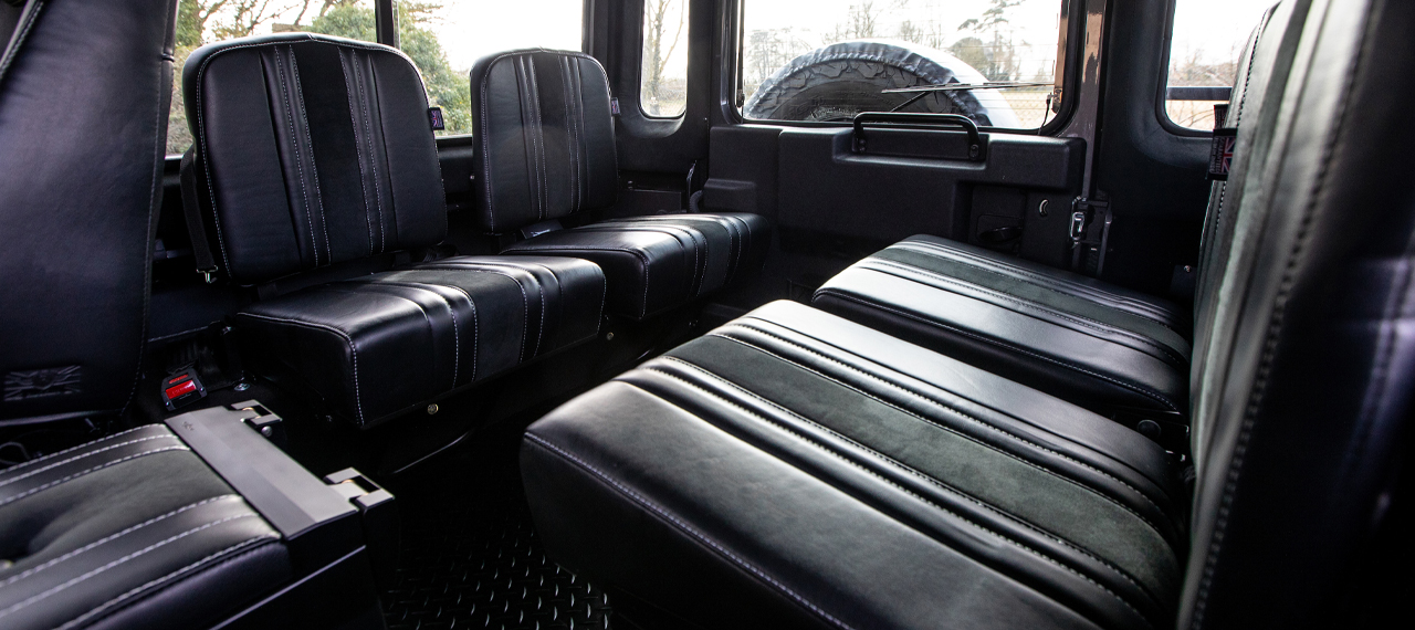 Load area view of Land Rover Defender 110 with tip-up seats